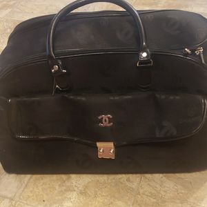 Medium sized Chanel luggage bag.